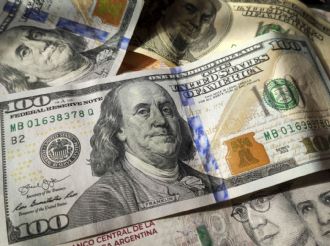 El dólar oficial subió y cerró en $1.465